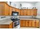 Bright kitchen featuring a stainless steel oven and wood cabinets at 2413 Se 23Rd St, Ocala, FL 34471