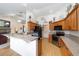 This spacious kitchen features wood cabinets and light countertops at 2413 Se 23Rd St, Ocala, FL 34471