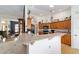 Bright kitchen offering ample countertop space with bar seating and wood cabinets at 2413 Se 23Rd St, Ocala, FL 34471