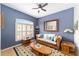 Comfortable living room featuring a decorative window, comfortable seating, and a beautiful rug at 2413 Se 23Rd St, Ocala, FL 34471
