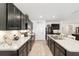 Beautiful kitchen featuring sleek countertops, dark cabinets, and modern appliances in an efficient design at 2552 Ne 42Nd Rd, Ocala, FL 34470