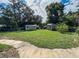 Expansive backyard featuring two sheds and a large green space at 3545 Se 24Th Ave, Ocala, FL 34471