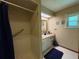 Bright bathroom featuring a shower and a vanity with a large framed mirror at 3545 Se 24Th Ave, Ocala, FL 34471