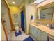 Bathroom featuring a vanity with a sink, and a shower with blue curtains at 3545 Se 24Th Ave, Ocala, FL 34471