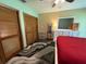 Bright bedroom featuring closets, dresser, and a cozy atmosphere at 3545 Se 24Th Ave, Ocala, FL 34471