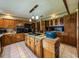 Spacious kitchen with an island cooktop, updated appliances, and ample cabinet space for storage at 3545 Se 24Th Ave, Ocala, FL 34471
