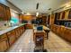 Bright kitchen with central island, modern appliances, spacious countertops, and wood cabinetry at 3545 Se 24Th Ave, Ocala, FL 34471