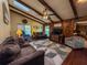 Comfortable living room with wood flooring, high ceilings, a ceiling fan and skylights for natural light at 3545 Se 24Th Ave, Ocala, FL 34471