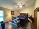 Spacious main bedroom featuring a large bed, ceiling fan, and ample natural light at 3545 Se 24Th Ave, Ocala, FL 34471