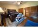 Comfortable main bedroom showcasing a bed, hardwood floors, and a ceiling fan at 3545 Se 24Th Ave, Ocala, FL 34471