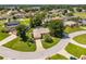 Aerial shot of a charming home on a neatly landscaped lot, surrounded by a well-kept neighborhood at 4300 Nw 4Th Cir, Ocala, FL 34475