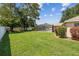 Grassy backyard featuring an enclosed pool area providing a private oasis for relaxation and entertainment at 4300 Nw 4Th Cir, Ocala, FL 34475