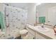 Simple bathroom featuring a neutral vanity, toilet, and a shower with a curtain at 4300 Nw 4Th Cir, Ocala, FL 34475