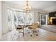 Dining room featuring a chandelier, and several windows at 4300 Nw 4Th Cir, Ocala, FL 34475