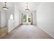 Open dining area with a large window and chandelier, creating an elegant space at 4300 Nw 4Th Cir, Ocala, FL 34475