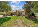 Beautifully landscaped front yard with lush green grass and mature trees surrounding the home at 4300 Nw 4Th Cir, Ocala, FL 34475