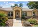 Inviting front entrance with manicured landscaping and a charming covered doorway at 4300 Nw 4Th Cir, Ocala, FL 34475