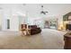 Spacious living room with vaulted ceilings, fireplace, and sliding glass doors to the pool at 4300 Nw 4Th Cir, Ocala, FL 34475