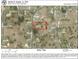 Aerial view of property outlined in red, surrounded by other homes in the neighborhood at 5917 Ne 61St Avenue Rd, Silver Springs, FL 34488