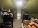 Unfinished attic space with boxes and stored items and an odd combination of items at 5917 Ne 61St Avenue Rd, Silver Springs, FL 34488