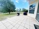 Backyard patio with a grill and paver stones, perfect for outdoor entertaining and relaxation at 5917 Ne 61St Avenue Rd, Silver Springs, FL 34488