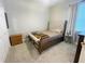 Comfortable bedroom with a soft bed, wooden nightstand, and nice window is perfect for relaxing at 5917 Ne 61St Avenue Rd, Silver Springs, FL 34488