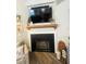 Cozy corner fireplace with mantel and hearth at 5917 Ne 61St Avenue Rd, Silver Springs, FL 34488