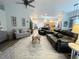 Open-concept living room featuring comfortable seating, a skylight, and seamless flow to the kitchen at 5917 Ne 61St Avenue Rd, Silver Springs, FL 34488