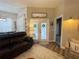Living room with access to the front porch at 5917 Ne 61St Avenue Rd, Silver Springs, FL 34488