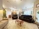 Open-concept living room with eat-in kitchen, with updated stainless appliances at 5917 Ne 61St Avenue Rd, Silver Springs, FL 34488