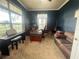 Cozy office with a piano and an executive desk and chair to complete the ensemble at 5917 Ne 61St Avenue Rd, Silver Springs, FL 34488