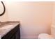 Powder room features granite countertop and sink at 7 Hill Prince Dr, Ocala, FL 34482
