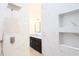 Bathroom showcasing a marble tile shower with recessed niche shelving and a granite vanity at 7 Hill Prince Dr, Ocala, FL 34482