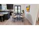 Cozy dining area featuring a round table with four chairs next to a kitchen with backyard views at 7 Hill Prince Dr, Ocala, FL 34482