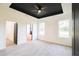 A spacious main bedroom with light wood-look floors, light walls, and a dark ceiling at 7 Hill Prince Dr, Ocala, FL 34482