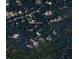 Aerial view of the property at 7695 SW 188th Ave, nestled among lush greenery and trees at 7695 Sw 188Th Ave, Dunnellon, FL 34432