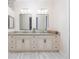 Bathroom with double vanity, granite counters, and modern fixtures at 7695 Sw 188Th Ave, Dunnellon, FL 34432