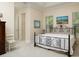 Spacious bedroom features an ornamental wrought iron bed frame at 7695 Sw 188Th Ave, Dunnellon, FL 34432