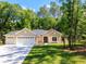 Charming single-story home with a well-manicured lawn, three-car garage and a classic architectural style at 7695 Sw 188Th Ave, Dunnellon, FL 34432