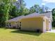 Back of the house and part of the long driveway at 7695 Sw 188Th Ave, Dunnellon, FL 34432