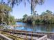 Scenic river view with docks and ramp, perfect for swimming, tubing, and floating at 7695 Sw 188Th Ave, Dunnellon, FL 34432