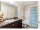 Full bathroom featuring a vanity with dark cabinets, neutral paint, and shower with blue curtain at 8 Diamond Club Rd, Ocala, FL 34472