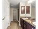 Bathroom featuring double vanity, tile floors, walk-in shower, and a separate tub at 8 Diamond Club Rd, Ocala, FL 34472