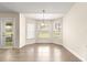 Tile-floored breakfast nook featuring large windows and an elegant chandelier at 8 Diamond Club Rd, Ocala, FL 34472