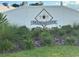 Sign for the Diamond Club community with green foliage in the landscaping at 8 Diamond Club Rd, Ocala, FL 34472
