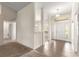 Bright foyer with tiled entrance leading to carpeted areas and a well-lit interior at 8 Diamond Club Rd, Ocala, FL 34472