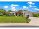Well-maintained home featuring verdant lawn, pruned shrubs, and a beige mailbox at 8 Diamond Club Rd, Ocala, FL 34472