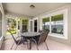 Cozy screened patio with outdoor seating, offering a relaxing space at 8 Diamond Club Rd, Ocala, FL 34472