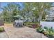 A delightful back patio offers a peaceful retreat with outdoor seating, a garden, and manicured landscaping at 8144 Sw 108Th Street Rd, Ocala, FL 34481