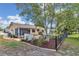 View of home with a fenced yard, back patio area, and lush greenery creating a private outdoor retreat at 8144 Sw 108Th Street Rd, Ocala, FL 34481
